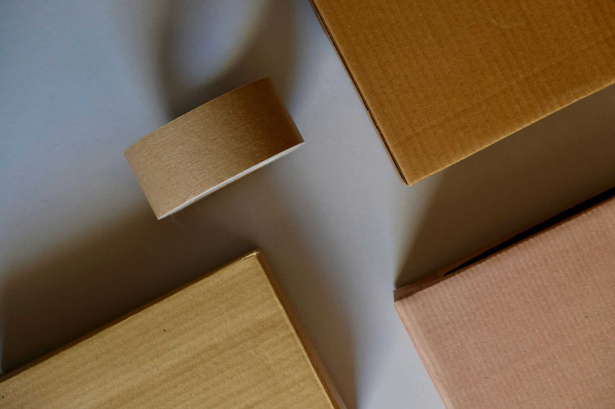 Packing materials including cardboard boxes and tape, essential for securely organizing personal items during a move.